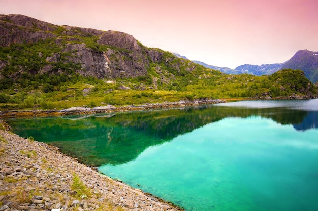 Rocky shore of mountain lake in autumn Beautiful nature of Norway