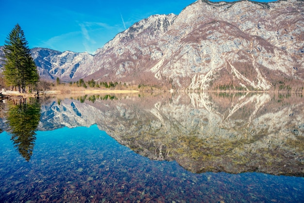 Rocky shore of the mountain lake Beautiful nature Reflection on the lake