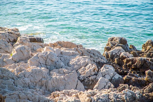 Rocky shore near the blue sea Nature background