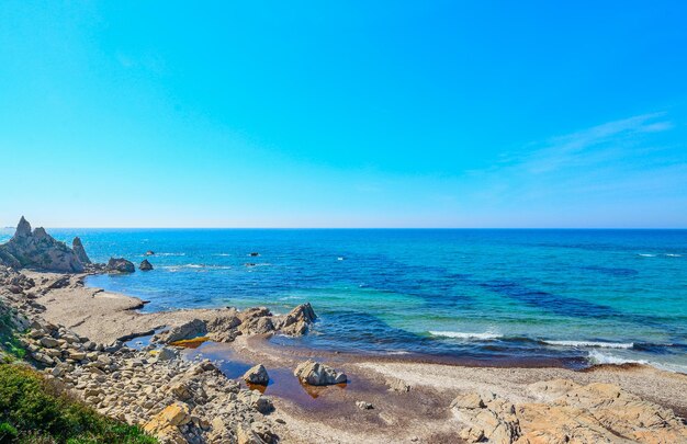 Rocky shore in Rena Majore Sardinia