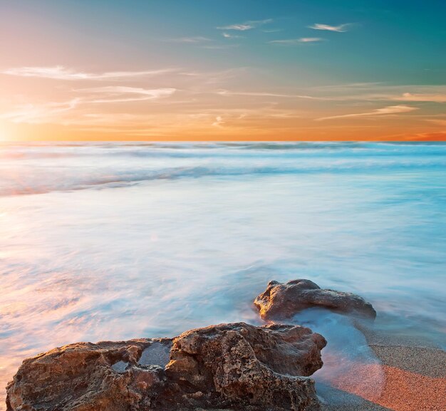 Rocky shore at sunset in Sardinia