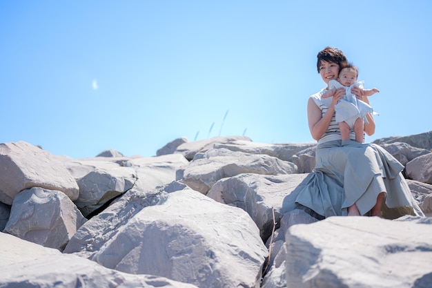 Rocky shoreline and parent and child