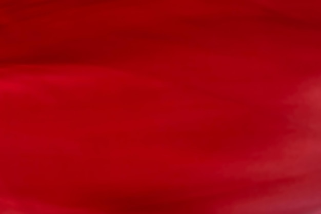 Rode abstracte kunst achtergrondtextuur van zijde en golflijnen in beweging voor klassiek luxe design