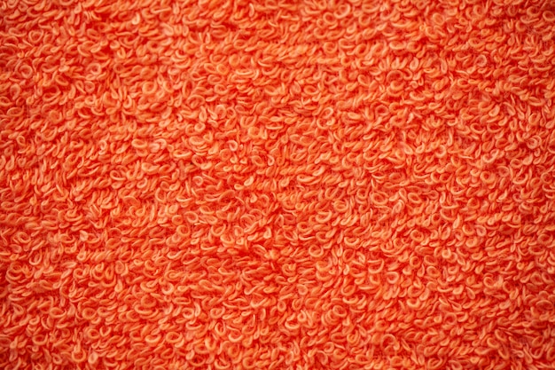 Foto rode badstof natuurlijke katoenen handdoektextuur als achtergrond