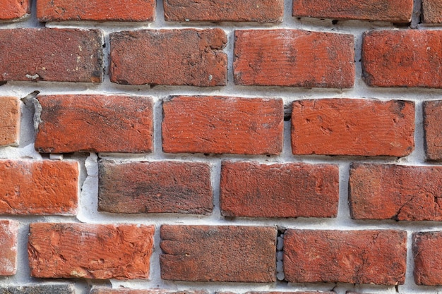 Rode bakstenen muur en achtergrond