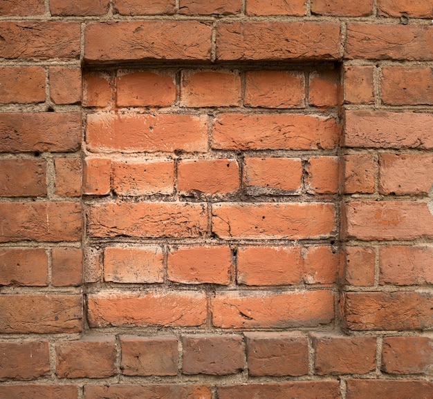 Rode bakstenen vierkante frame oude muur