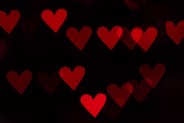 Rode harten bokeh als achtergrond Valentijnsdag concept 14 februari
