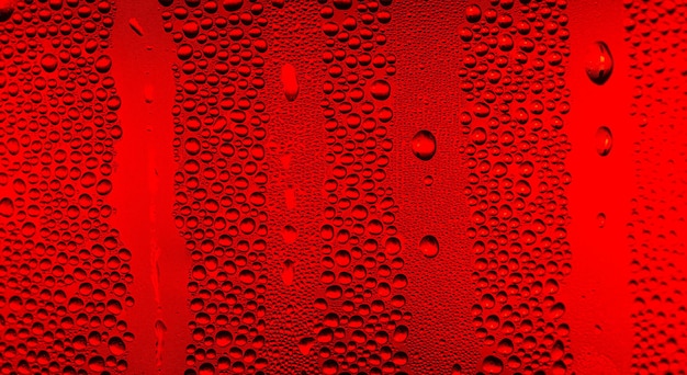 rode macro waterdruppel textuur Waterdruppels op rode achtergrond