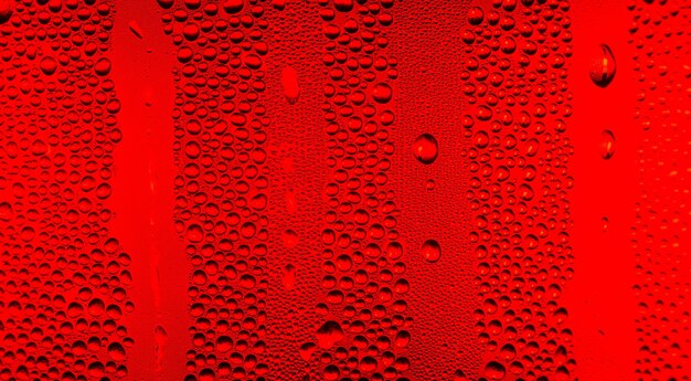 rode macro waterdruppel textuur Waterdruppels op rode achtergrond