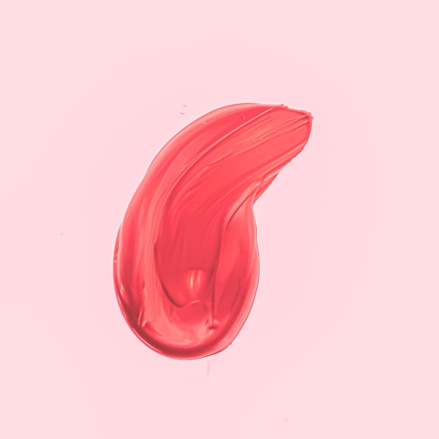 Rode penseelstreek of make-up vlekken close-up schoonheid cosmetica en lippenstift textuur