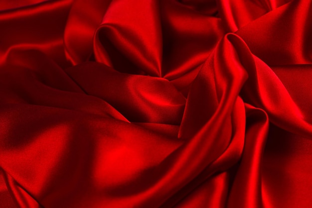 Rode zijde of satijn luxe stof textuur kan gebruiken als abstracte achtergrond Bovenaanzicht