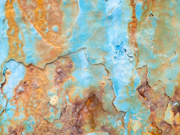 Roest op een blauw oppervlak Scheuren in de verf Oud ijzer Roestige vlekken op metaal Achtergrond