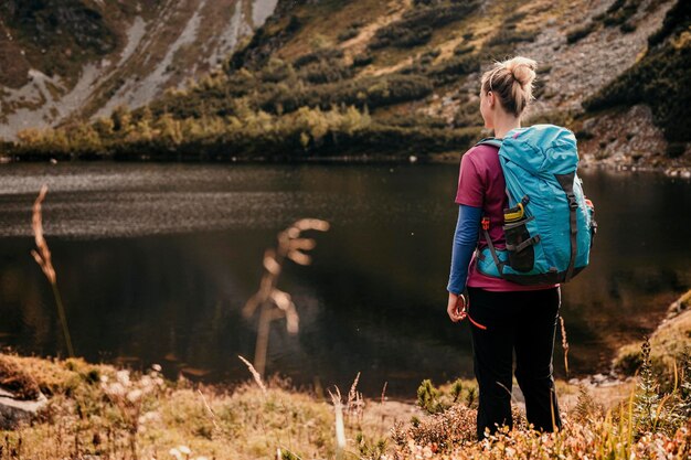 Rohacske lake in slovakia western tatras mountains rohace slovakia woman hiker with backpack rises to the mountains discovery travel concept