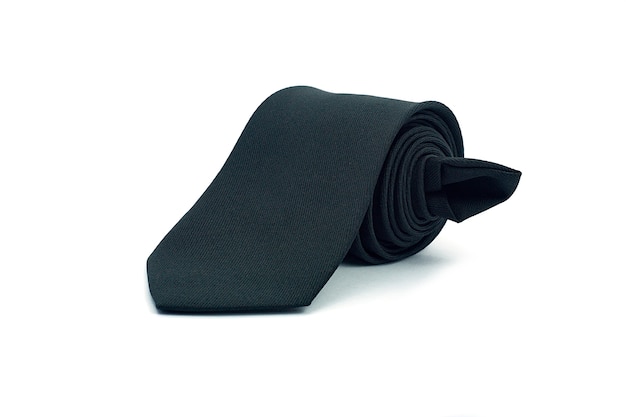 Roll of black necktie on white background