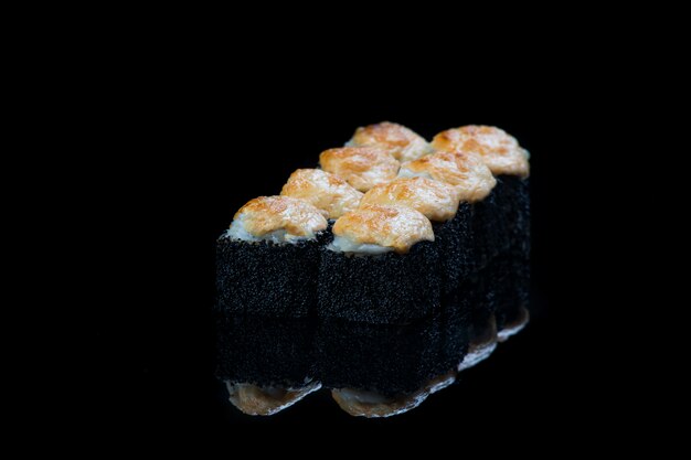 Roll On A Black surface reflection . Japanese food.