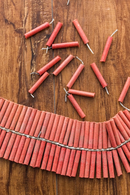 Roll of firecrackers on wood table.