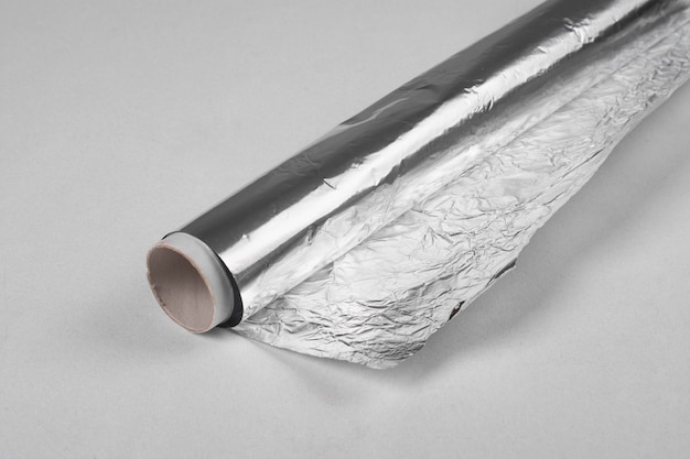 Roll of foil on the table closeup