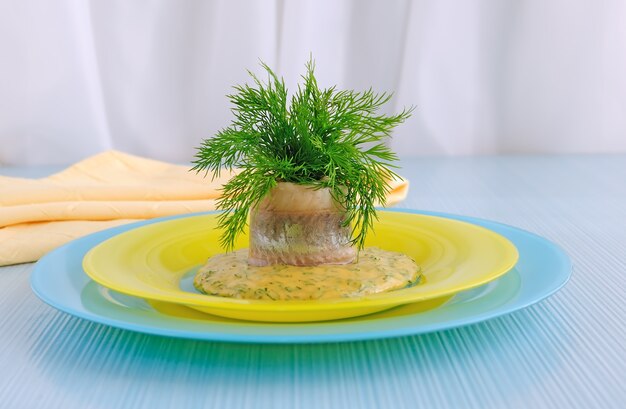 Roll of herring fillets in mustard sauce with herbs