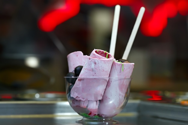 Photo roll ice cream is made by hand on the freezer