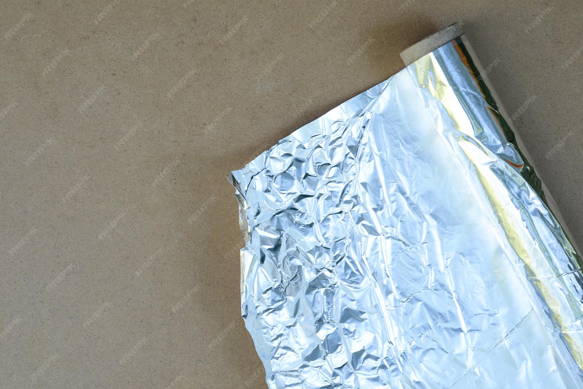 Premium Photo Roll of metal foil foil for baking in oven tinfoil