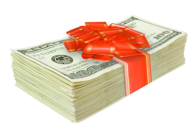 Roll of money with a red bow isolated on white