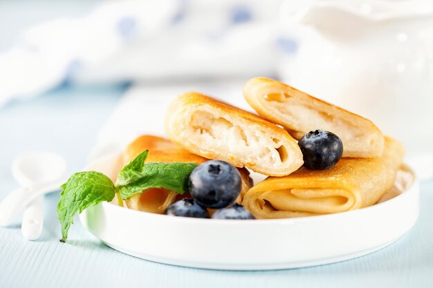 Photo roll pancakes with cottage cheese and berries