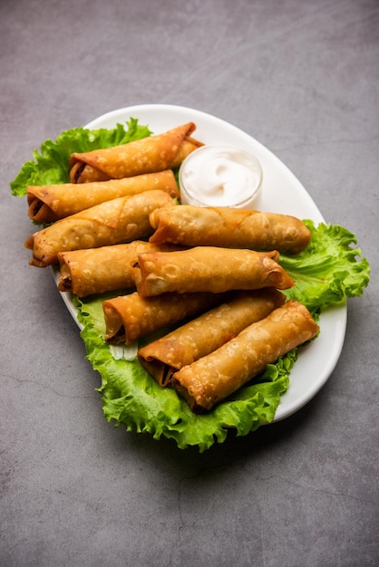 Roll shaped Cigar Samosa are the perfect finger food served with ketchup