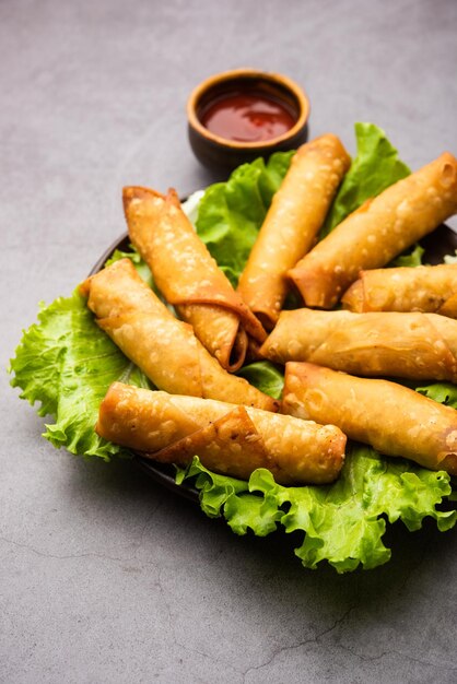 Roll shaped Cigar Samosa are the perfect finger food served with ketchup