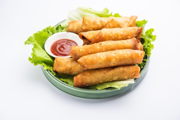 Roll shaped Cigar Samosa are the perfect finger food served with ketchup