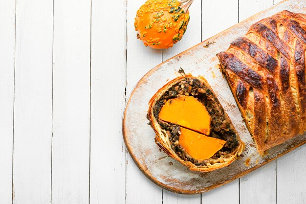 Roll stuffed with pumpkin and mushrooms. Pumpkin baked in a bread loaf.