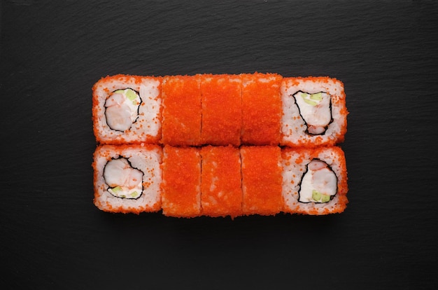 Roll sushi with salmon prawn avocado cream cheese sushi menu\
japanese food