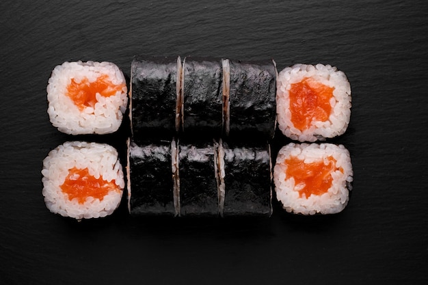 Roll sushi with salmon prawn avocado cream cheese sushi menu\
japanese food