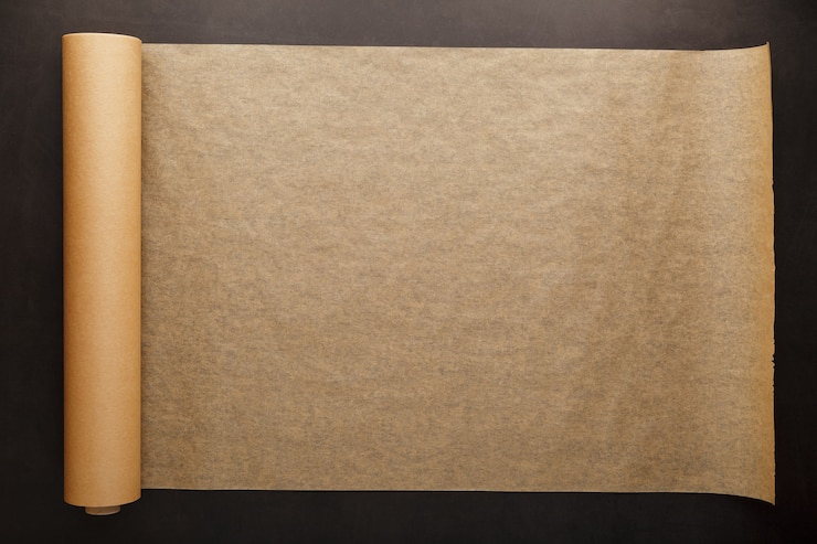 Photo roll of unfolded brown parchment paper for baking food