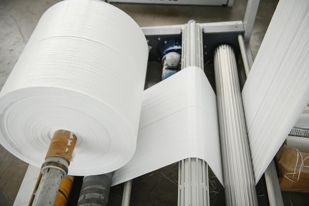 Roll of white fabric for cutting