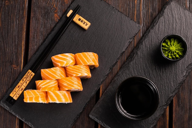 Roll with fish sushi with chopsticks asian food concept