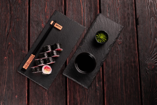 Roll with fish sushi with chopsticks asian food concept