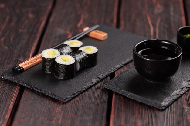 Roll with fish sushi with chopsticks asian food concept