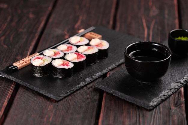Roll with fish sushi with chopsticks asian food concept