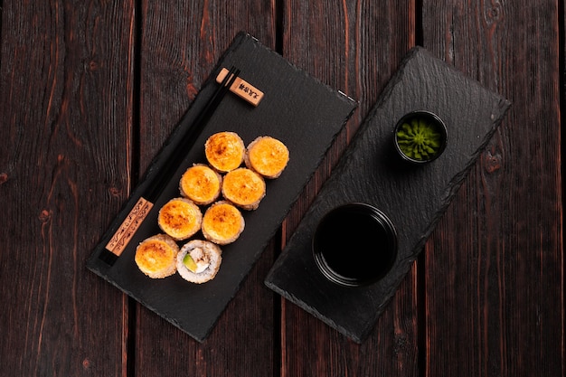 Roll with fish sushi with chopsticks asian food concept