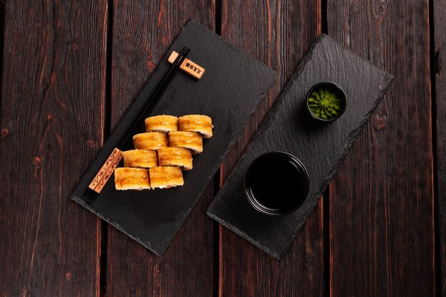 Roll with fish sushi with chopsticks asian food concept