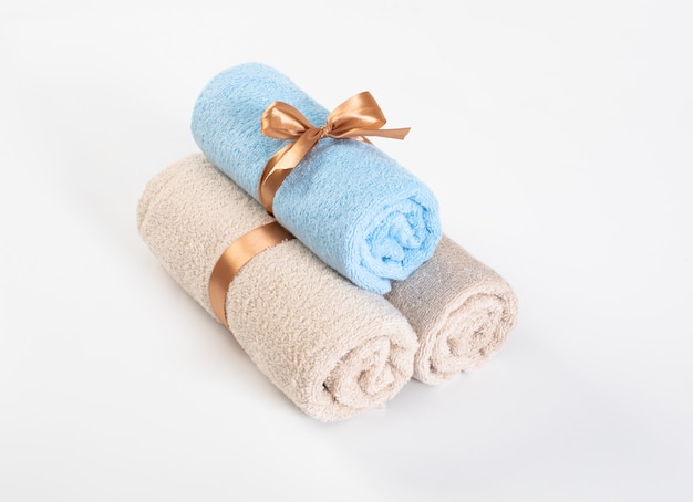 Rolled blue and pink terry towels 