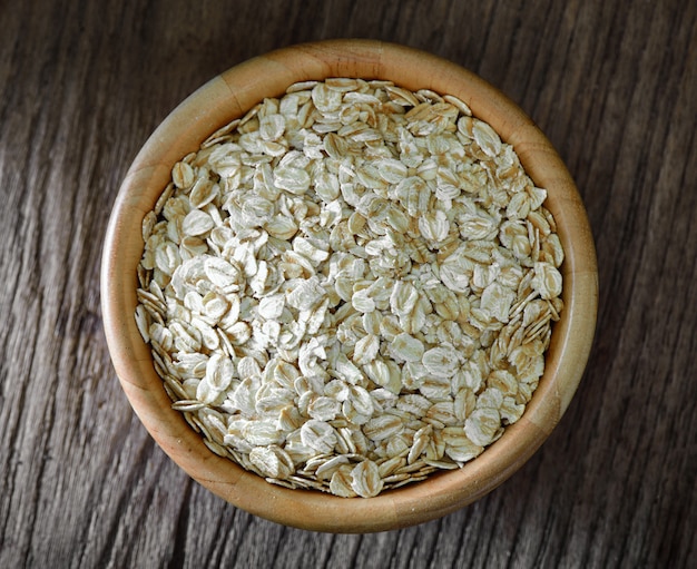 Rolled oats on a wooden table