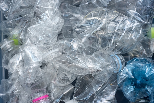 Rolled plastic bottles for recycling.