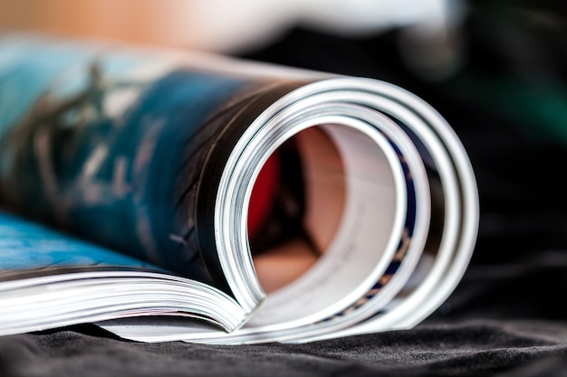 Rolled up magazines with reflection on  background