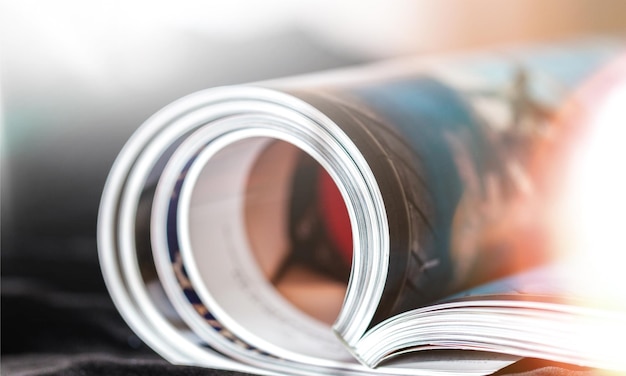 Photo rolled up magazines with reflection on  background