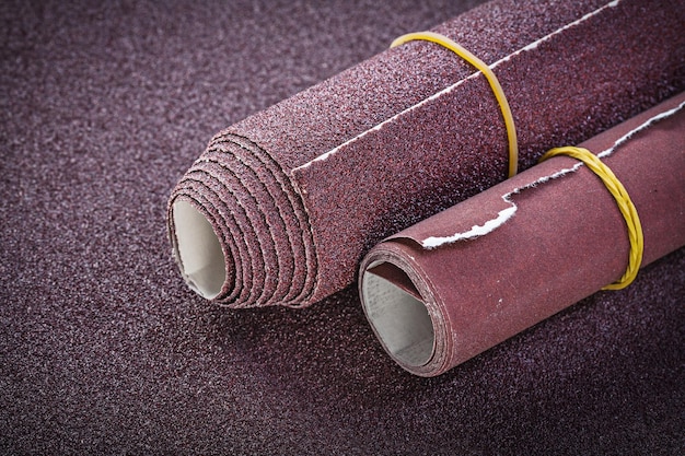 Photo rolled up sand paper top view abrasive tools