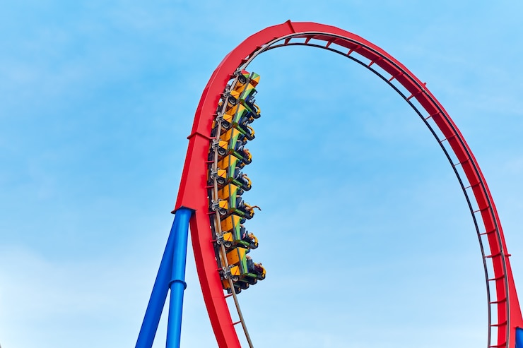 Photo roller coaster in funny amusement  park.