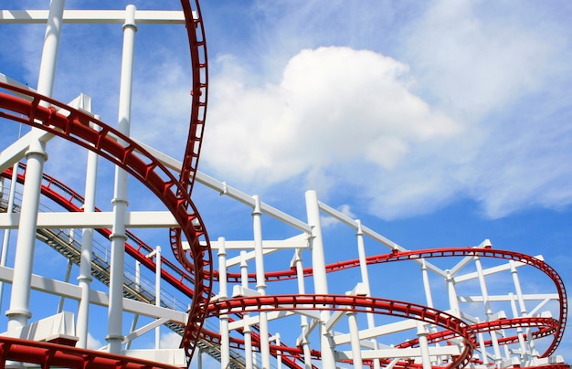 Roller coaster with clouds blue sky