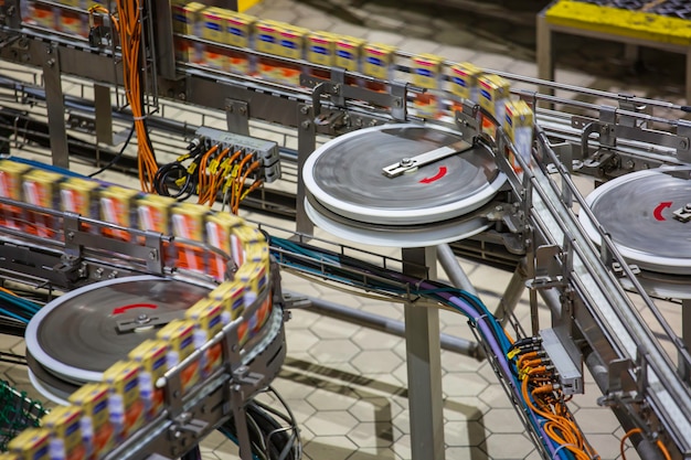 Roller conveyor pack up of flowing milk box to sell