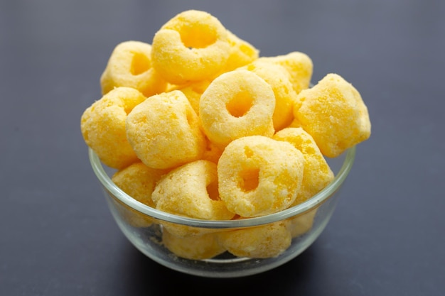 Roller corn snack on dark background